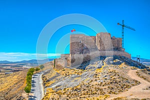 Castle at Consuegra surrounded with white windmills, Spain