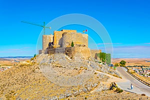 Castle at Consuegra surrounded with white windmills, Spain