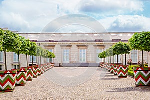 Castle gardens in front of Royal Castle in Warsaw, saxon facade Poland. Landscape design, park with shrubs and green lawns