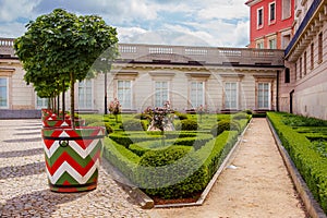Castle gardens in front of Royal Castle in Warsaw, saxon facade Poland. Landscape design, park with shrubs and green lawns