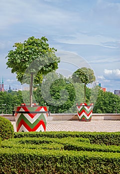 Castle gardens in front of Royal Castle in Warsaw, saxon facade Poland. Landscape design, park with shrubs and green lawns