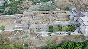 Castle of Gjirokastra and city center. Aerial view of ancient fortress Albania