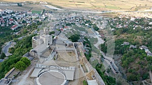 Castle of Gjirokastra and city center. Aerial view of ancient fortress Albania