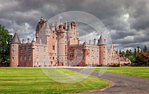 The Castle of Glamis is the typical Scottish castle, stately, full of turrets and battlements, was the legendary stage photo