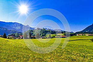 Castle of Gruyeres with green meadows, Haut-Intyamon, Gruyere, F