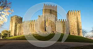 Castle of guimaraes in portugal at night with lamps