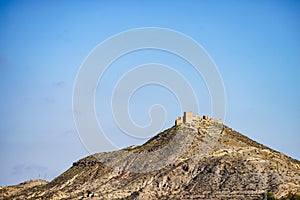 Castle on hill, Tabernas desert, Spain photo