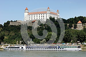 The Castle Hill, view over the Danube River, a cruise ship moored below the Hill, Bratislava, Slovakia