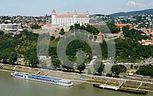 The Castle Hill, view over the Danube River, a cruise ship moored below the Hill, Bratislava, Slovakia