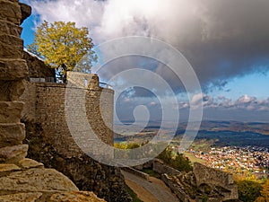 Medieval castle detail with view to town in valley