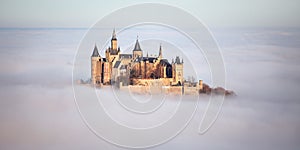 Castle Hohenzollern over the Clouds photo