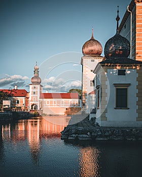 Castle Kottingbrunn during summer with the reflecting lake