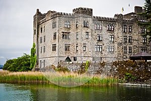 Castle by lake on gloomy rainy day , Ireland