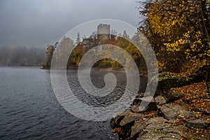 Castle Lichtenfels In Autumnal Landscape With Foggy Lake Ottenstein In Austria