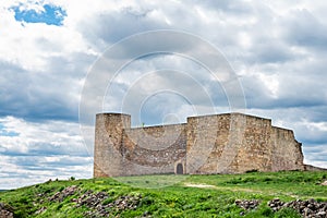 Castle of Medinaceli against a cloudy sky