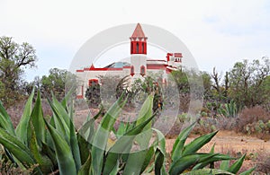 Castle with nopales and maguey in the mine of mineral de pozos guanajuato, mexico