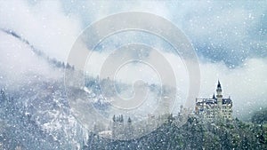 Castle Neuschwanstein on an early winter morning with snow covered mountains. Castle Neuschwanstein is a UNESCOsite