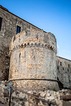 Castle Overlooking the Mountains: Breathtaking View of a Typical Italian Castle with Crenellations and Blue Sky in Rocca Imperiale