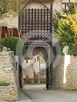 Gatehouse of medieval castle with portcullis raised photo