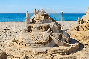 Castle of sand on the beach. Concept: unrealized dreams.