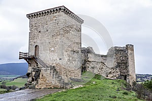 Castle of Santa Gadea del Cid with a dark sky in Burgos