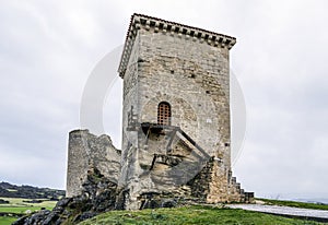 Castle of Santa Gadea del Cid with a dark sky in Burgos