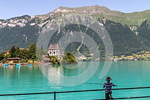 Castle Seeburg on the Iseltwald in the turquoise Brienz Lake