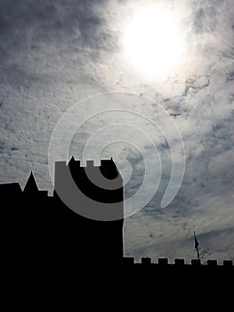 Black castle and cloudy sky photo