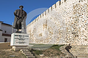 At the castle of Sines with statue in foreground, Portugal photo