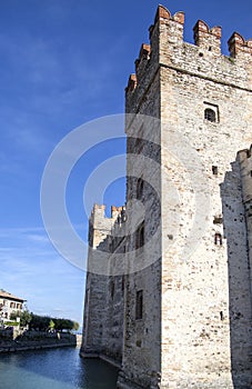 Castle in Sirmione - October 2, 2018: View to the medieval Rocca Scaligera castle 13th century in Sirmione town on Garda lake