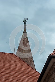 The castle spire with a statue on top