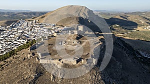 the castle of the star in the municipality of Teba as seen from a drone at sunset, Andalusia