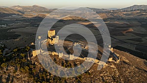 the castle of the star in the municipality of Teba as seen from a drone at sunset, Andalusia