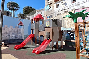 Castle surrounded by murals in the Playmobil themed Children\'s Park in Castalla, Alicante, Spain