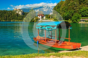 Castle and traditional wooden boat on Lake Bled,Slovenia,Europe