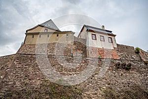 Castle Veste Otzberg, odenwald, view from low angle with old wall in front, cloudy day, germany