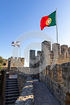 Castle wall with flags of Portugal and Lisbon of the Castelo de Sao Jorge