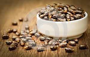 Castor beans in a ceramic bowl