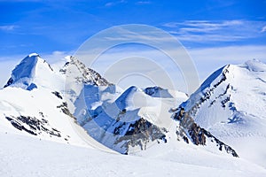 Castor and Pollux, Roccia Nera and slope of Breithorn, above Gorner glacier adjacent Matterhorn, Zermatt, Switzerland photo