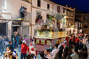 Easter procession in Castro del Rio with religious float and crowd