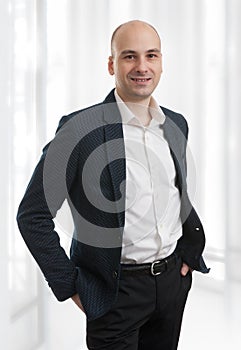 Casual bald man wearing suit photo