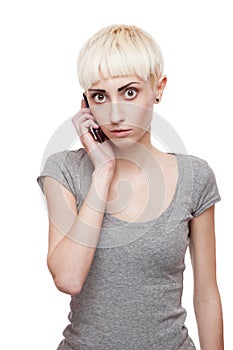 Casual blond girl holding cell phone