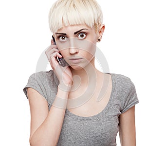 Casual blond girl holding cell phone