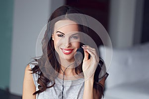 Casual brunette woman with headset