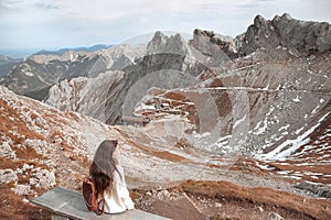 Casual brunette woman sitting on bench holding ice heart enjoyin