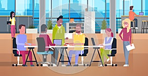 Casual Business People Working Together In Coworking Office Modern Team Metting Mix Race Businesspeople Sitting At Desk