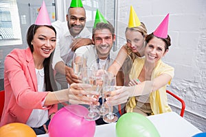 Casual business team toasting with champagne