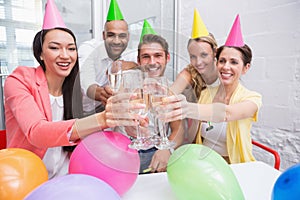 Casual business team toasting with champagne