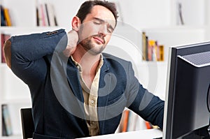 Casual Businessman With Pain In His Neck