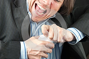 Casual Businessman Trying To Open Pill Bottle